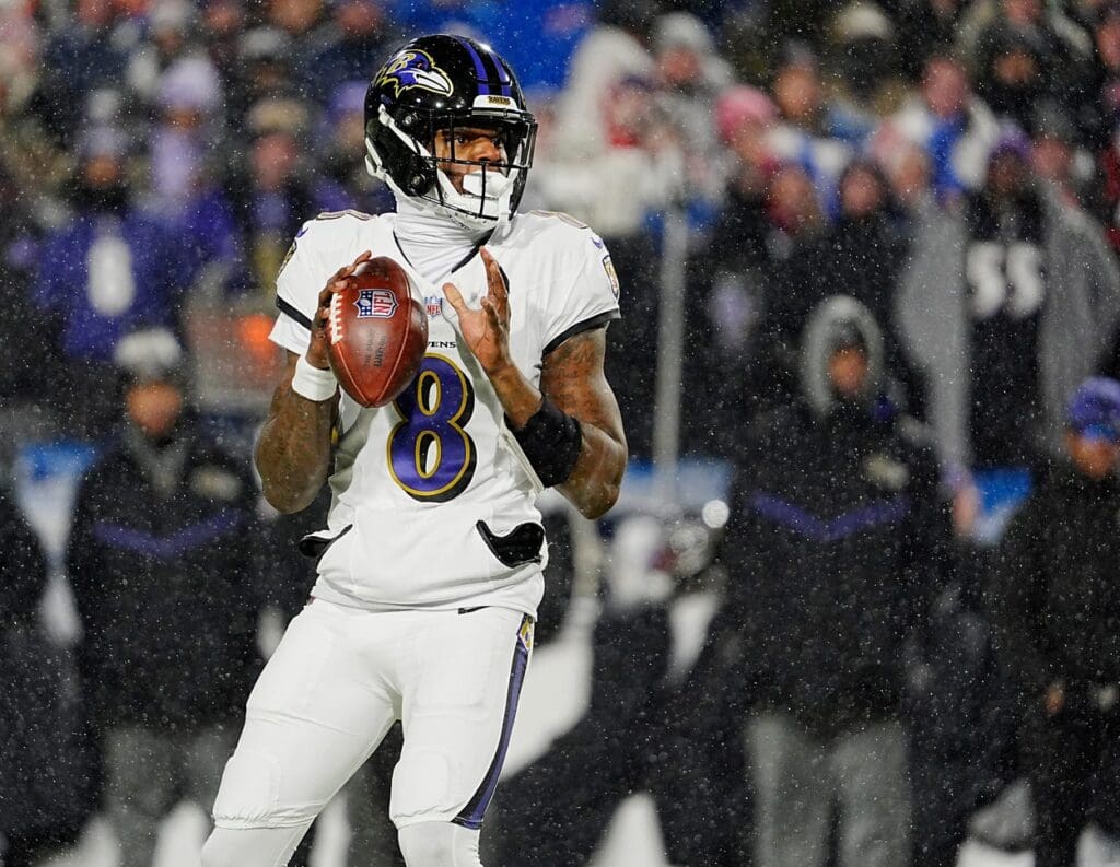 Baltimore Ravens quarterback Lamar Jackson gets ready to launch the ball during first half action at the Buffalo Bills divisional game against the Baltimore Ravens at Highmark Stadium in Orchard Park on Jan. 19, 2025.