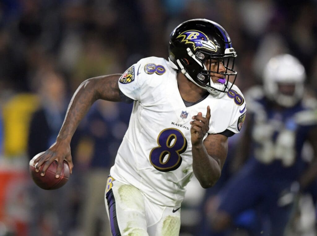 Dec 22, 2018; Carson, CA, USA; Baltimore Ravens quarterback Lamar Jackson (8) carries the ball against the Los Angeles Chargers during the second half at StubHub Center.