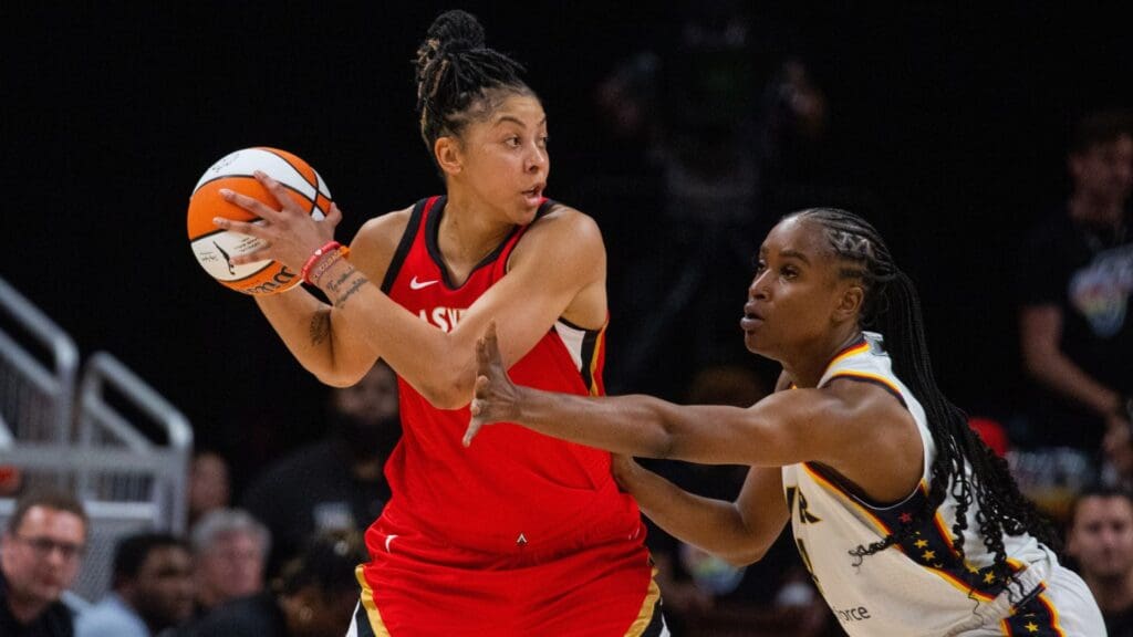 Jun 4, 2023; Indianapolis, Indiana, USA; Las Vegas Aces forward Candace Parker (3) looks to pass the ball while Indiana Fever center Queen Egbo (4) defends in the first half at Gainbridge Fieldhouse.