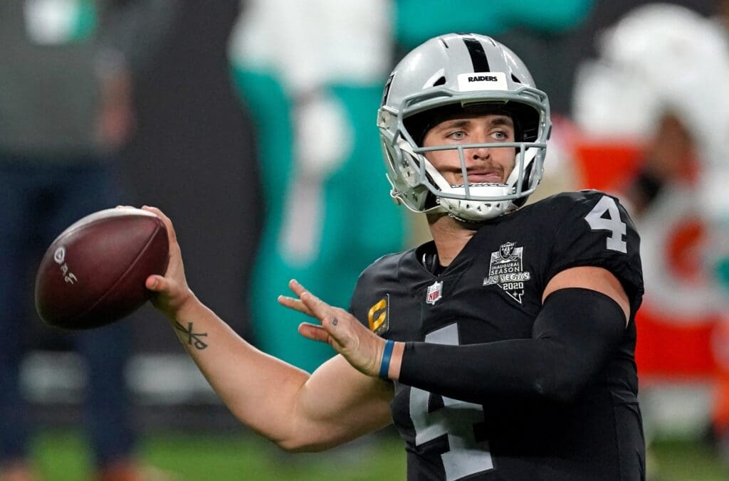Dec 26, 2020; Paradise, Nevada, USA; Las Vegas Raiders quarterback Derek Carr (4) throws a pass against the Miami Dolphins during the first half at Allegiant Stadium.