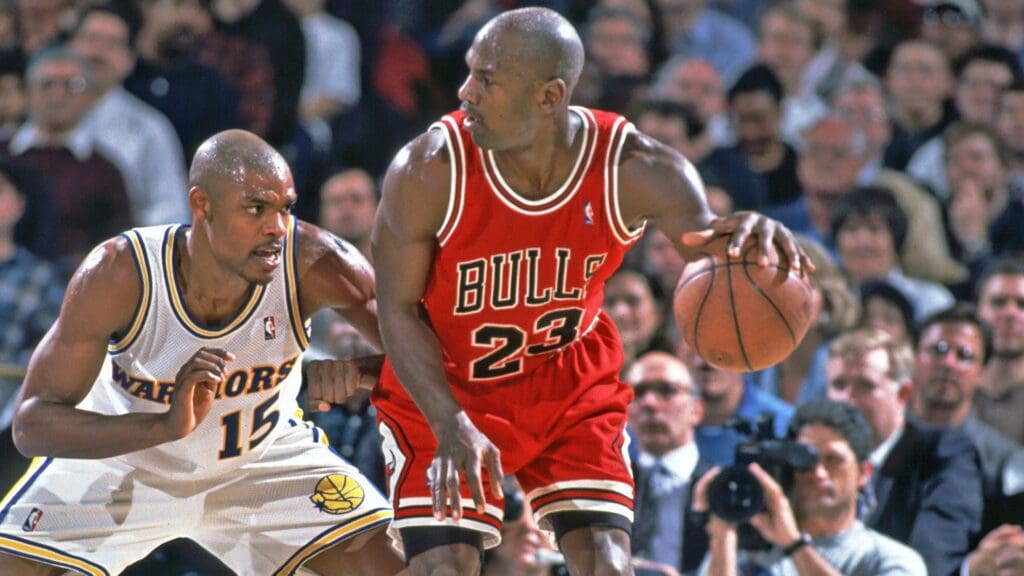 Unknown Date; Oakland, CA, USA; FILE PHOTO; Chicago Bulls guard (23) Michael Jordan in action against Golden State Warriors forward (15) Latrell Sprewell at the Oakland Coliseum.