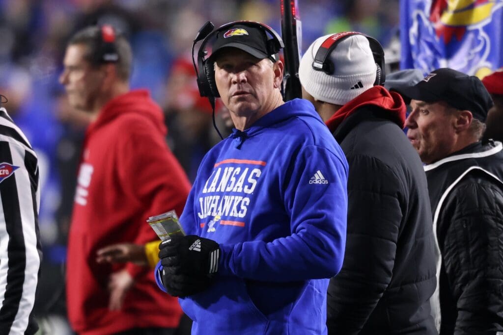 Nov 16, 2024; Provo, Utah, USA; Kansas Jayhawks head coach Lance Leipold checks the scoreboard against the Brigham Young Cougars during the second quarter at LaVell Edwards Stadium.