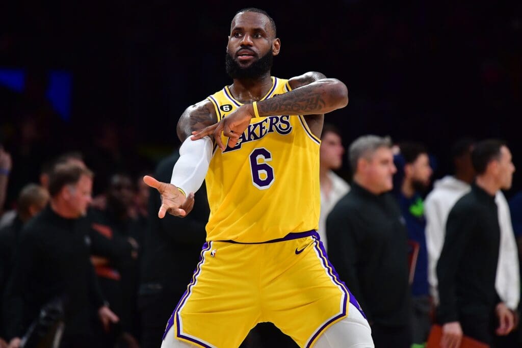 Apr 11, 2023; Los Angeles, California, USA; Los Angeles Lakers forward LeBron James (6) reacts after Los Angeles Lakers guard Dennis Schroder (17) scores a three poibt basket against the Minnesota Timberwolves during the second half at Crypto.com Arena.
