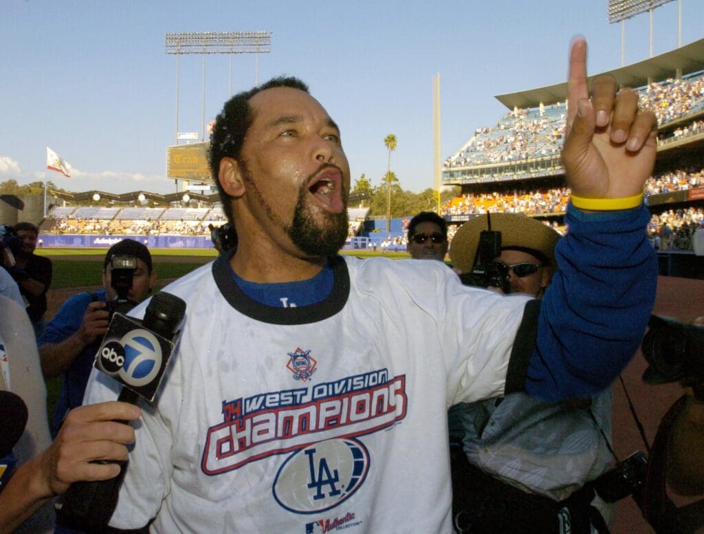 Los Angeles Dodgers pitcher Jose Lima (27) celebrates after 7-3 victory over the San Francisco Giants to clinch the National League west division title at Dodger Stadium.