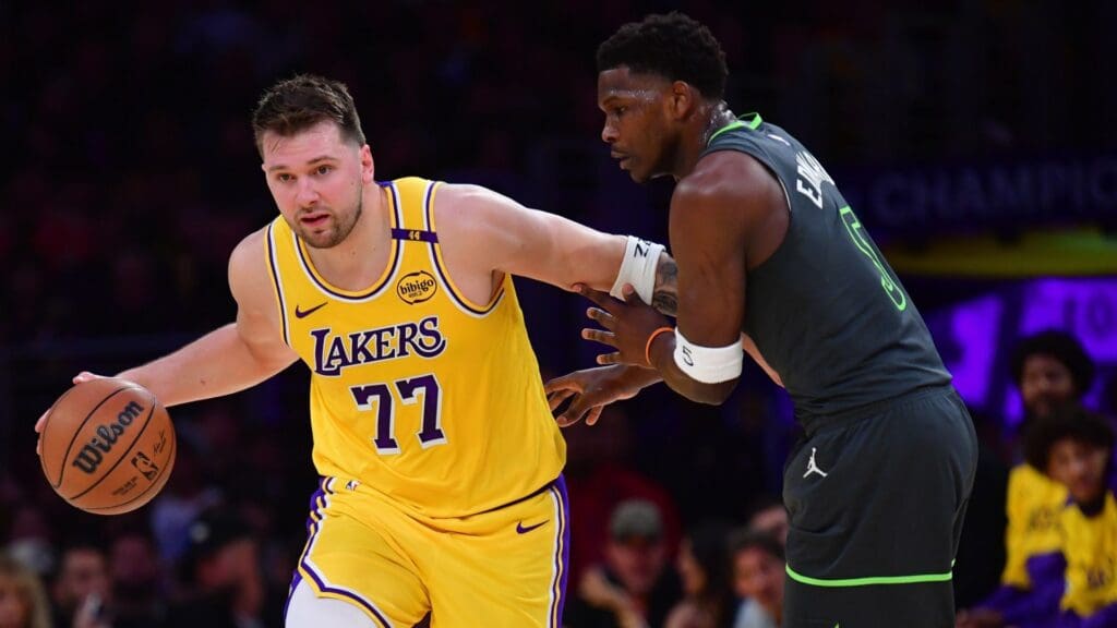 Apr 30, 2025; Los Angeles, California, USA; Los Angeles Lakers guard Luka Doncic (77) controls the ball against Minnesota Timberwolves guard Anthony Edwards (5) during the first half in game five of first round for the 2025 NBA Playoffs at Crypto.com Arena.