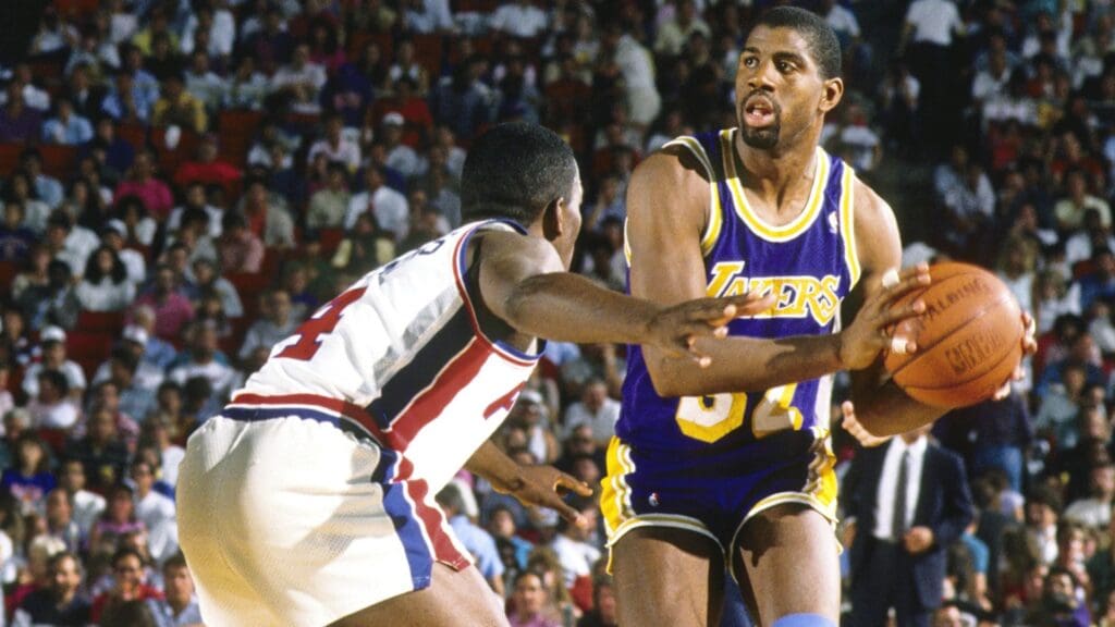 Jun 1988; Detroit, MI, USA; FILE PHOTO; Los Angeles Lakers guard Magic Johnson (32) is defended by Detroit Pistons guard Joe Dumars (4) during the 1988 NBA Finals at the Silverdome.