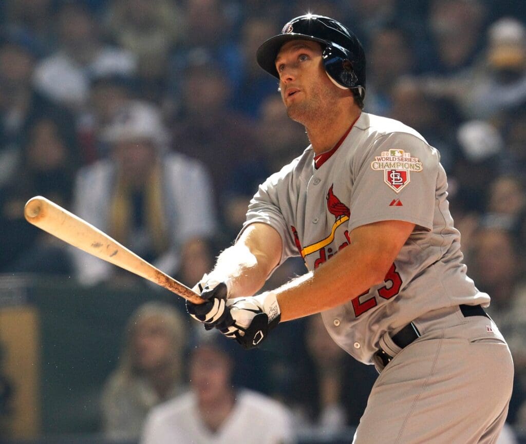 St. Louis Cardinals David Freese hits a two-run homer during the third inning of their game against the Milwaukee Brewers Friday, April 6, 2012 at Miller Park in Milwaukee, Wis.
