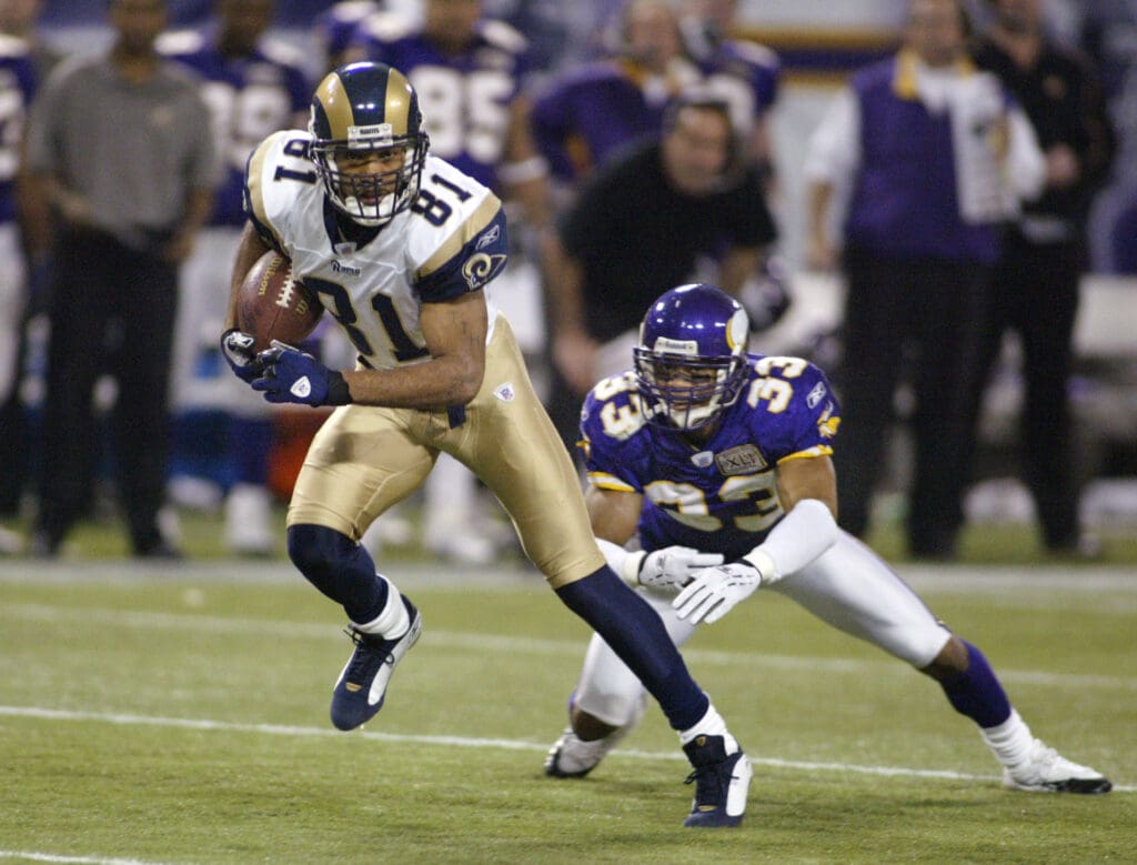 Dec 11, 2005; Minneapolis, MN, USA; St. Louis Rams wide receiver #81 Torry Holt breaks free from Minnesota Vikings cornerback #33 Ralph Brown en route to a 17 yard gain in the second quarter at the Metrodome. 