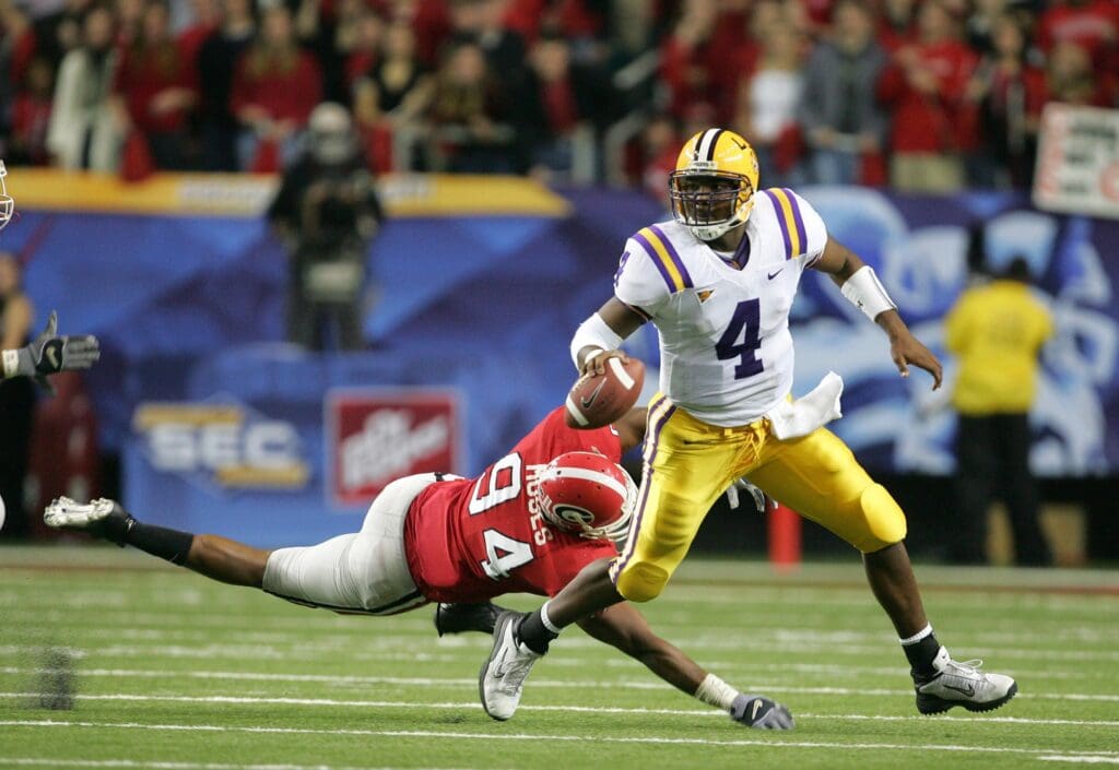 Dec 3, 2005: Atlanta, GA, USA: Louisiana State Tigers quaterback (4) JaMarcus Russell evades a tackle by Georgia Bulldogs defensive end (94) Wuentin Moses in the first half of the Southeastern Conference Championship game at the Georgia Dome.