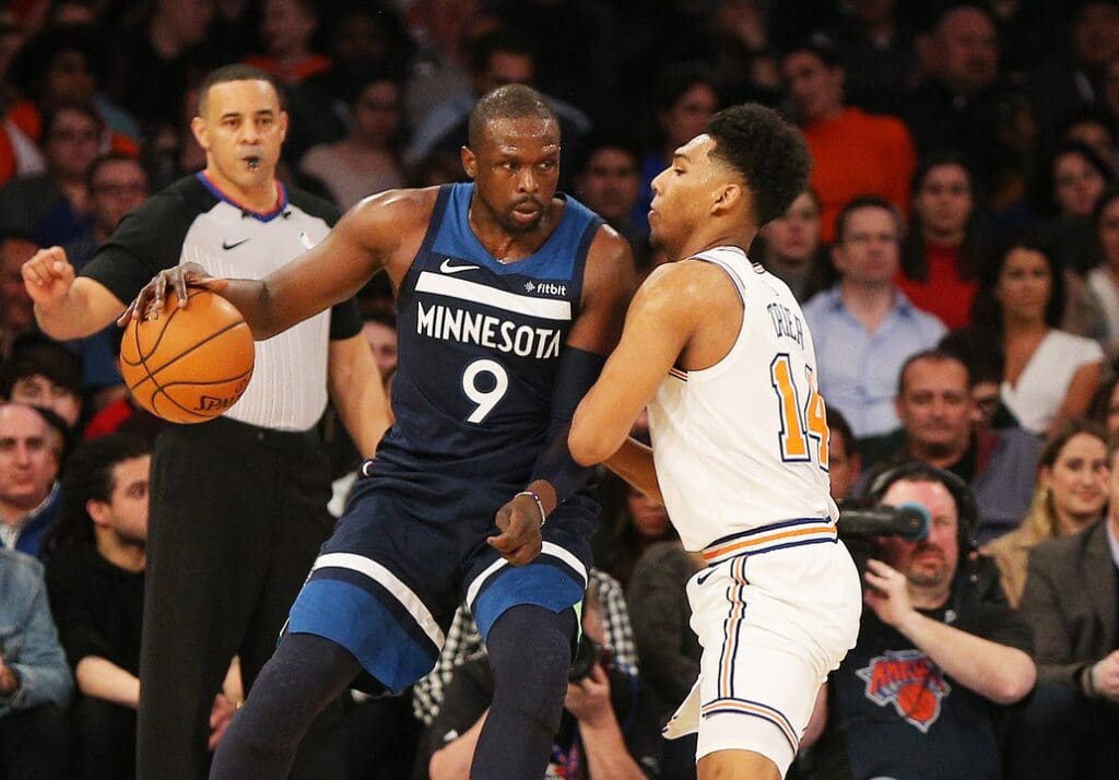 Feb 22, 2019; New York, NY, USA; Minnesota Timberwolves forward Luol Deng (9) dribbles the ball as New York Knicks guard Allonzo Trier (14) defends during the second half at Madison Square Garden. Mandatory Credit: Andy Marlin-USA TODAY Sports