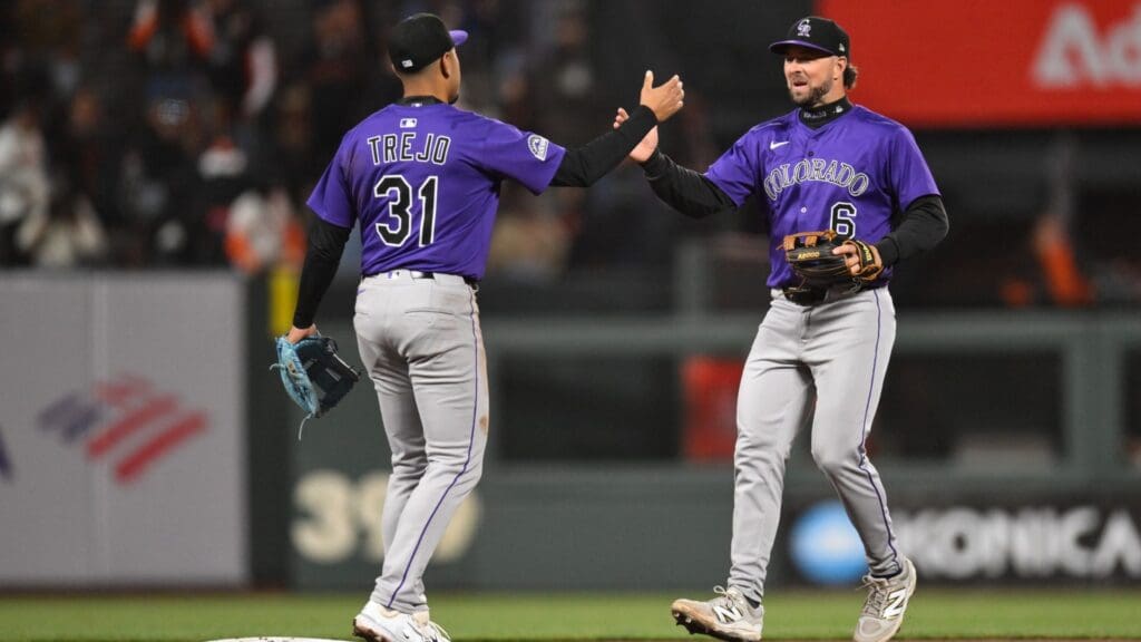 May 1, 2025; San Francisco, California, USA; Colorado Rockies second baseman Kyle Farmer (6) and shortstop Alan Trejo (31) celebrate their win over the San Francisco Giants in the ninth inning at Oracle Park