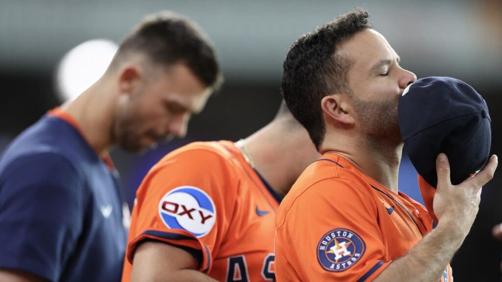 May 13, 2025; Houston, Texas, USA; Houston Astros designated hitter Jose Altuve (27) and teammates listen to the National Anthem before playing against the Kansas City Royals at Daikin Park