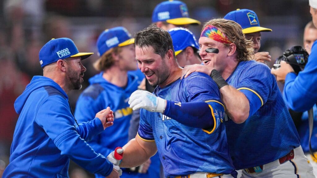 May 23, 2025; Minneapolis, Minnesota, USA; Minnesota Twins outfielder Harrison Bader (12) hugs first base Ty France (13) after his walk off home run against the Kansas City Royals in the ninth inning at Target Field.