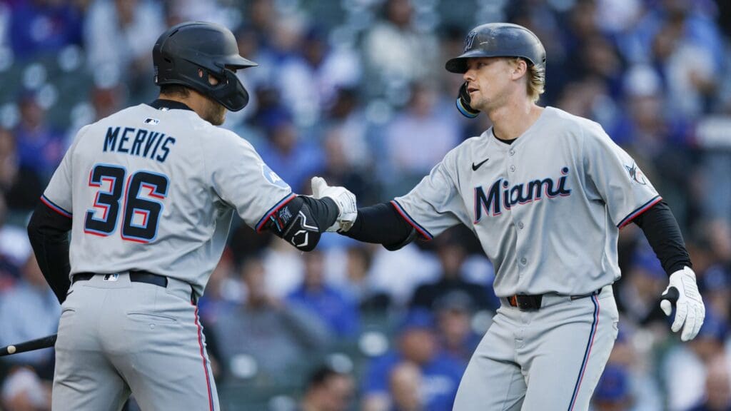 May 14, 2025; Chicago, Illinois, USA; Miami Marlins center fielder Kyle Stowers (28) celebrates with first baseman Matt Mervis (36) after hitting a solo home run against the Chicago Cubs during the second inning at Wrigley Field.
