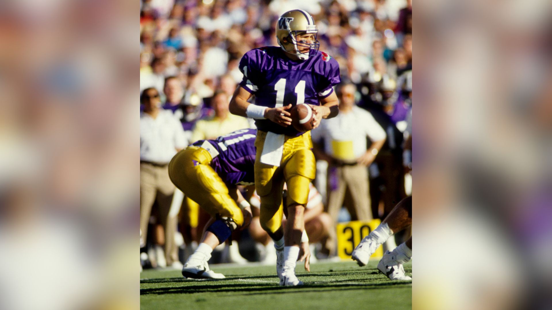 Jan 1, 1991; Pasadena, CA, USA: FILE PHOTO; Washington Huskies quarterback Mark Brunell (11) in action against the Iowa Hawkeyes during the 1991 Rose Bowl where Washington defeated Iowa 46-34 at the Rose Bowl Stadium.