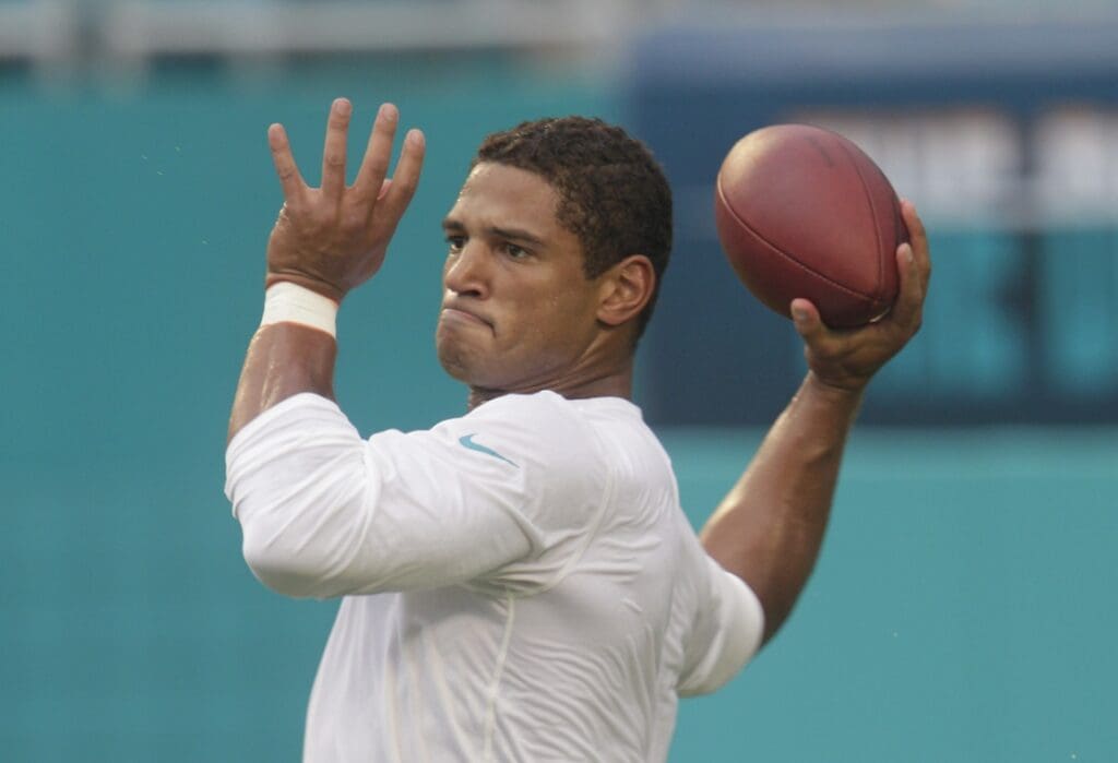 Aug 29, 2015; Miami Gardens, FL, USA; Miami Dolphins quarterback Josh Freeman (5) throws a pass during pre game warmups before an NFL preseason football game against the Atlanta Falcons at Sun Life Stadium.