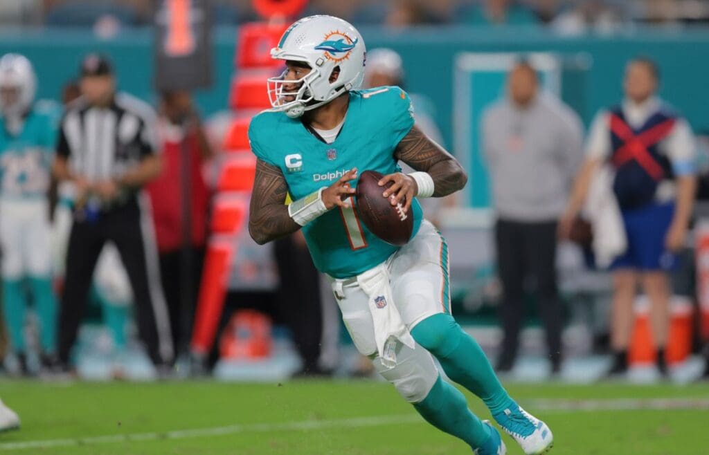 Dec 22, 2024; Miami Gardens, Florida, USA; Miami Dolphins quarterback Tua Tagovailoa (1) drops back against the San Francisco 49ers during the fourth quarter at Hard Rock Stadium.