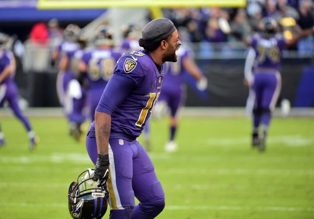 Nov 25, 2018; Baltimore, MD, USA; Baltimore Ravens wide receiver Michael Crabtree (15) reacts after linebacker Terrell Suggs (not pictured) scores a touchdown in the fourth quarter against the Oakland Raiders at M&T Bank Stadium.