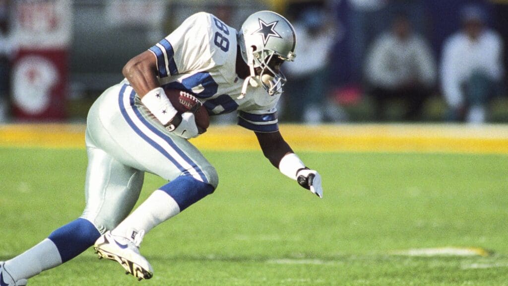 Jan 28, 1996; Tempe, AZ, USA; FILE PHOTO; Dallas Cowboys wide receiver Michael Irvin (88) carries the ball against the Pittsburgh Steelers during Super Bowl XXX at Sun Devil Stadium. The Cowboys defeated the Steelers 27-17.