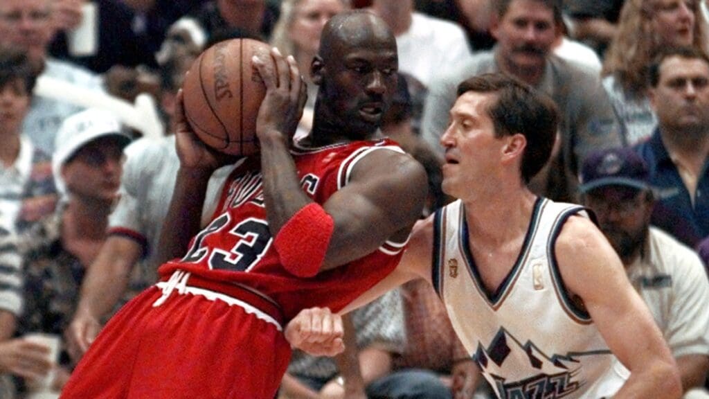 Jun 11, 1997; Salt Lake City, USA; Michael Jordan leans into Jeff Hornacek during the 3rd quarter in game five of the 1997 NBA Finals at the Delta Center.