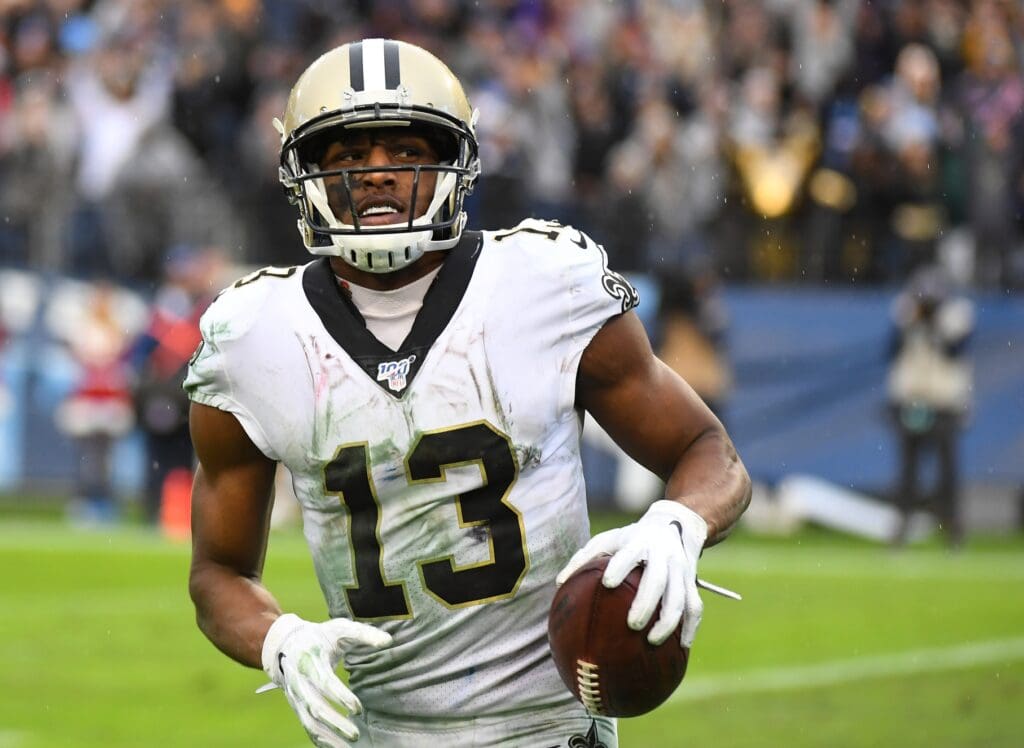 Dec 22, 2019; Nashville, Tennessee, USA; New Orleans Saints wide receiver Michael Thomas (13) breaks the record for receptions in a season with this touchdown reception during the second half against the Tennessee Titans at Nissan Stadium.