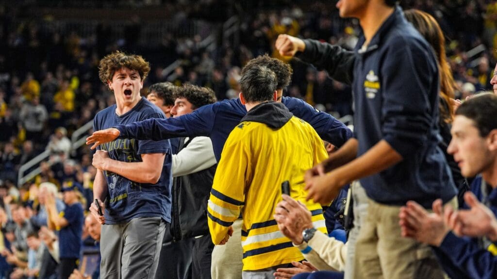 Michigan Wolverines fans celebrate the Wolverines' late push to tie up the game during the second half at Crisler Center in Ann Arbor on Thursday, Feb. 27, 2025.