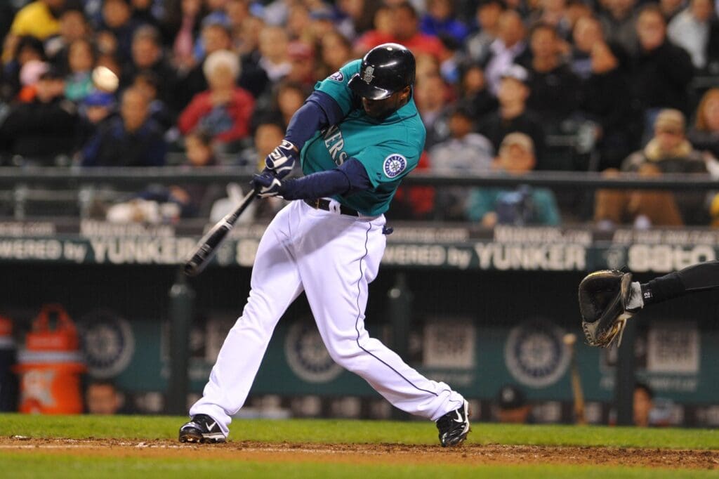 May 6, 2011; Seattle, WA, USA; Seattle Mariners left fielder Milton Bradley (15) hits a RBI double against the Chicago White Sox in the sixth inning at Safeco Field.
