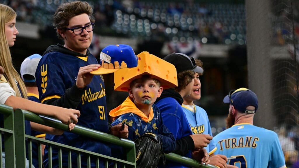 Oct 1, 2024; Milwaukee, Wisconsin, USA; Milwaukee Brewers fans attempt to get autographs during batting practice for game one of the Wildcard round for the 2024 MLB Playoffs against the New York Mets at American Family Field
