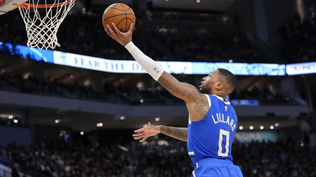 Mar 15, 2025; Milwaukee, Wisconsin, USA; Milwaukee Bucks guard Damian Lillard (0) shoots during the third quarter against the Indiana Pacers at Fiserv Forum.