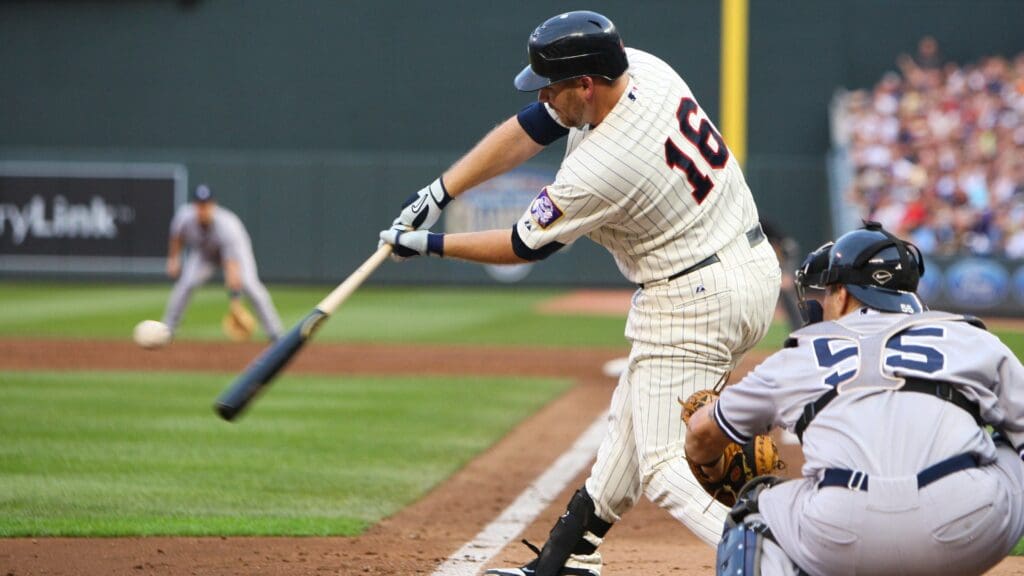 August 20, 2011; Minneapolis, MN, USA; Minnesota Twins outfielder Jason Kubel (16) hits a two-RBI single during the second inning against the New York Yankees at Target Field.