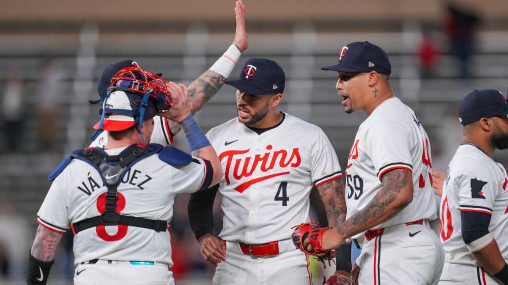 May 28, 2024; Minneapolis, Minnesota, USA; Minnesota Twins shortstop Carlos Correa (4) and the team celebrate after the game against the Kansas City Royals at Target Field.