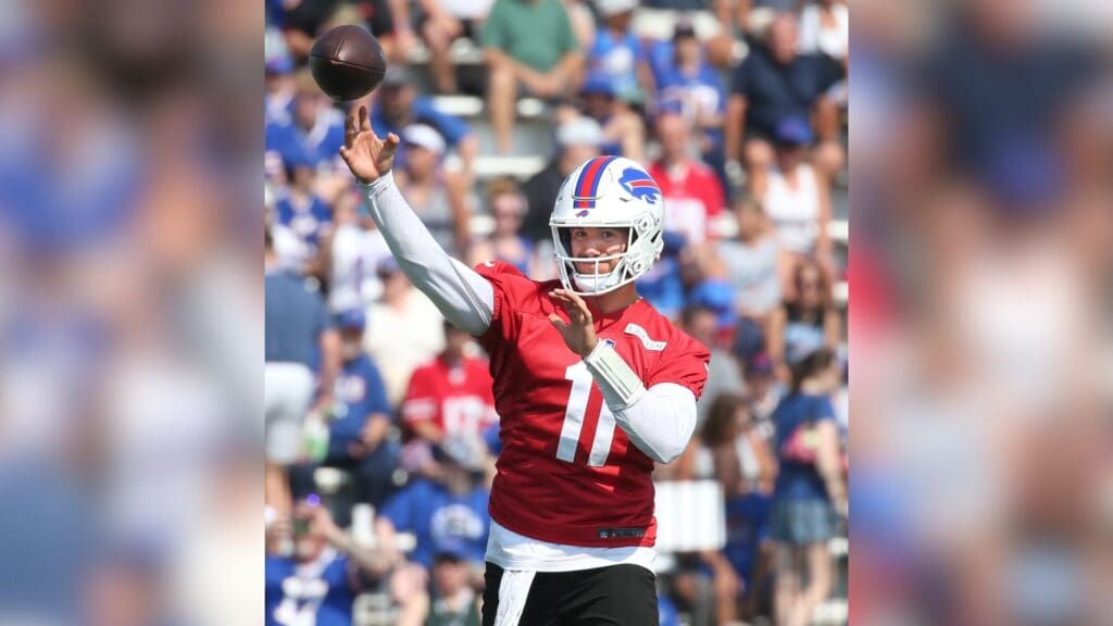 Bills quarterback Mitch Trubisky throws to the end zone during route drills.
