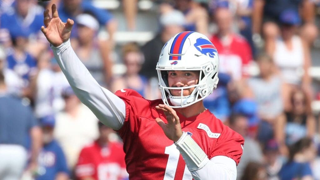 Bills quarterback Mitch Trubisky throws to the end zone during route drills.