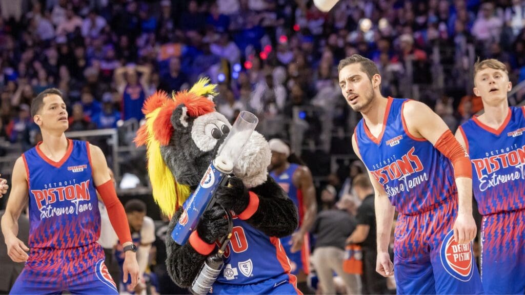 Apr 10, 2025; Detroit, Michigan, USA; Hooper, the Detroit Pistons mascot, shoots tee shirts into the crowd on a play stoppage against the New York Knicks during the second half at Little Caesars Arena
