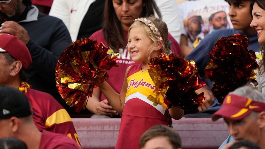 Sep 10, 2022; Stanford, California, USA; Young USC Trojans fan dresses up like a cheerleader and cheers during the second quarter against the Stanford Cardinal at Stanford Stadium
