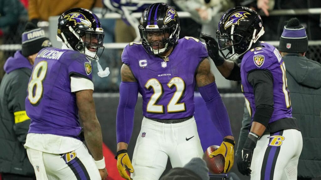Jan 11, 2025; Baltimore, Maryland, USA; Baltimore Ravens running back Derrick Henry (22) celebrates with wide receiver Nelson Agholor (15) and quarterback Lamar Jackson (8) after scoring a touchdown against the Pittsburgh Steelers in the third quarter in an AFC wild card game at M&T Bank Stadium