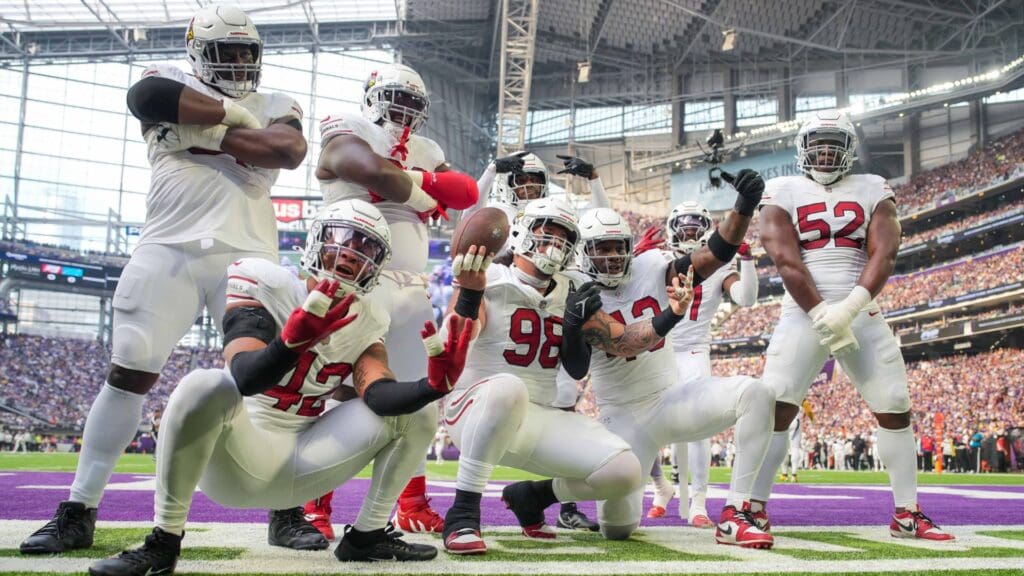 Dec 1, 2024; Minneapolis, Minnesota, USA; Arizona Cardinals defensive tackle Roy Lopez (98) celebrates his fumble recovery with his team against the Minnesota Vikings in the first quarter at U.S. Bank Stadium