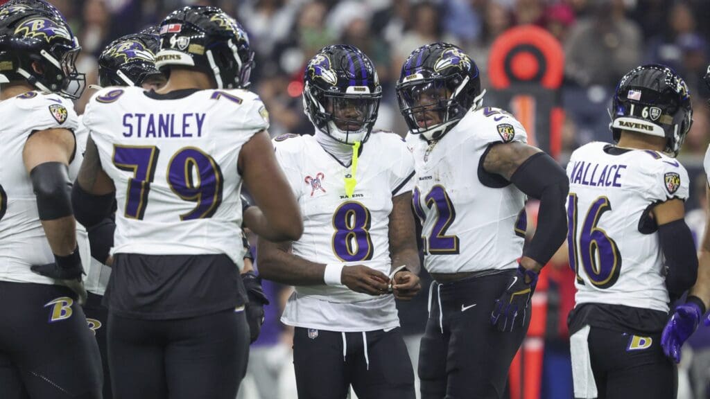 Dec 25, 2024; Houston, Texas, USA; Baltimore Ravens quarterback Lamar Jackson (8) and running back Derrick Henry (22) before a play during the game against the Houston Texans at NRG Stadium