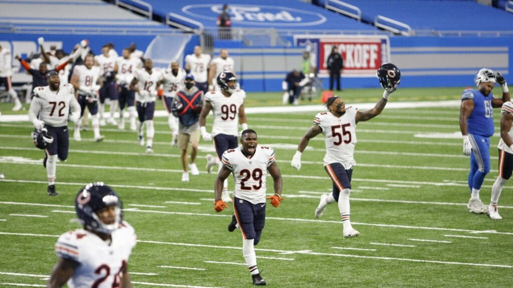 Sep 13, 2020; Detroit, Michigan, USA; Chicago Bears running back Tarik Cohen (29) and linebacker Josh Woods (55) storm the field with the rest of their team after the game against the Detroit Lions at Ford Field