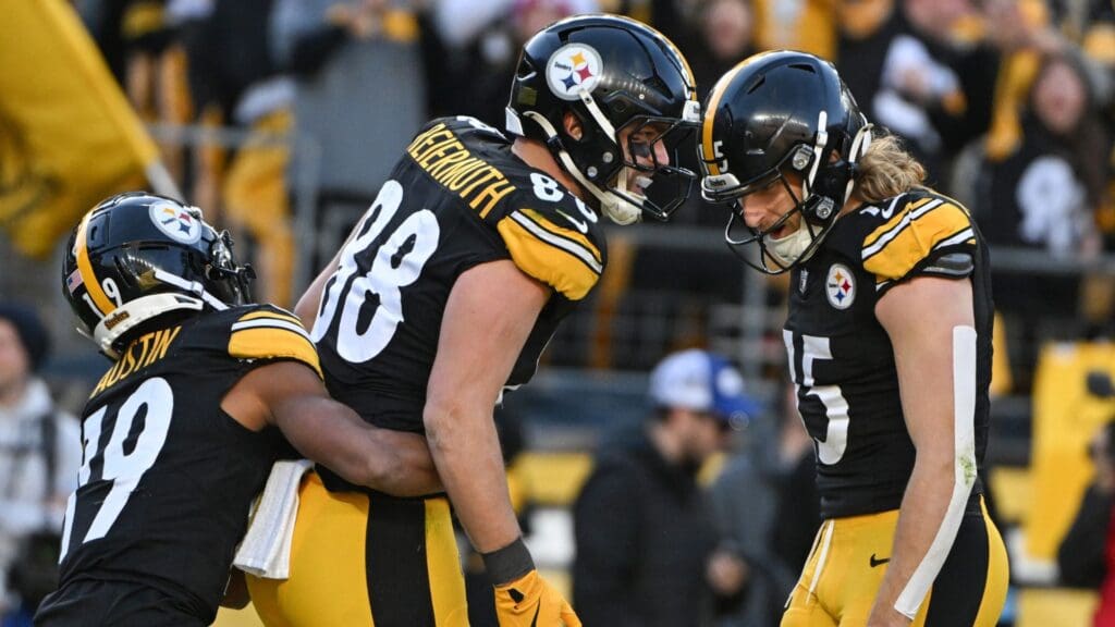 Dec 8, 2024; Pittsburgh, Pennsylvania, USA; Pittsburgh Steelers tight end Pat Freiermuth (88) celebrates a 20-yard touchdown pass with Calvin Austin III (19) and Ben Skowronek (15) during the third quarter at Acrisure Stadium