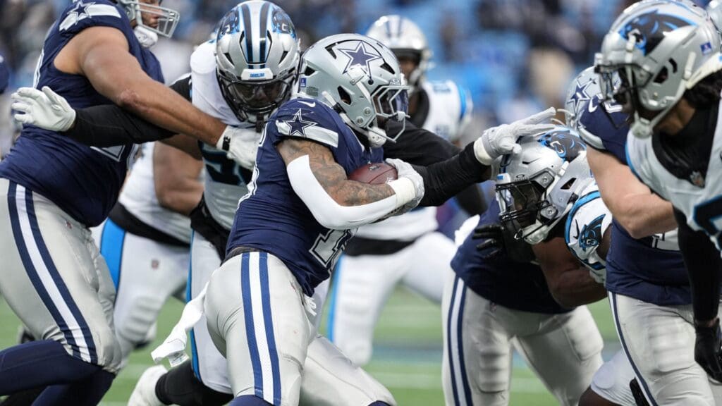 Dec 15, 2024; Charlotte, North Carolina, USA; Dallas Cowboys running back Ezekiel Elliott (15) runs during the second half against the Carolina Panthers at Bank of America Stadium.
