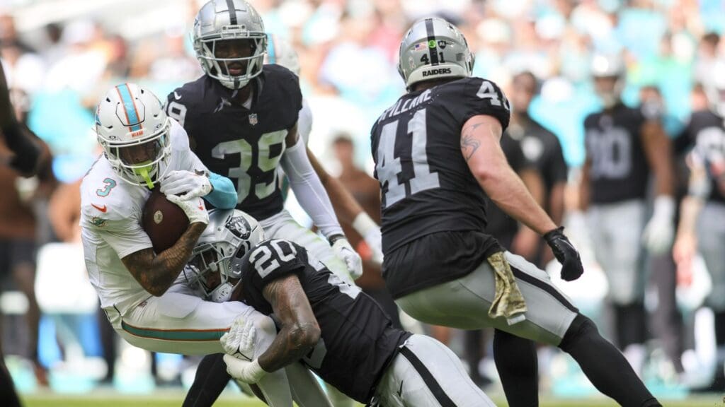 Nov 19, 2023; Miami Gardens, Florida, USA; Miami Dolphins wide receiver Robbie Chosen (3) is tackle by Las Vegas Raiders safety Isaiah Pola-Mao (20) during the second quarter at Hard Rock Stadium