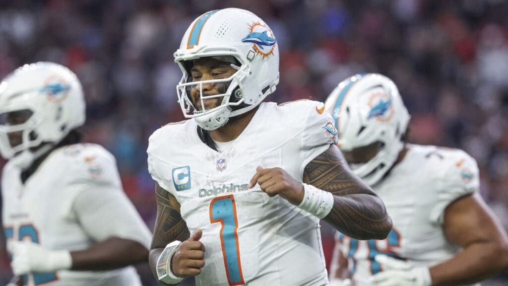 Dec 15, 2024; Houston, Texas, USA; Miami Dolphins quarterback Tua Tagovailoa (1) jogs off the field after a play during the fourth quarter against the Houston Texans at NRG Stadium
