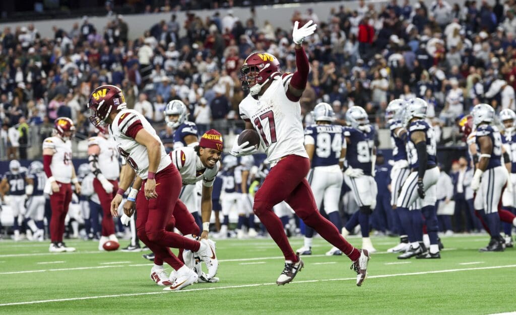 Jan 5, 2025; Arlington, Texas, USA; Washington Commanders wide receiver Terry McLaurin (17) celebrates after scoring the game-winning touchdown during the fourth quarter against the Dallas Cowboys at AT&T Stadium