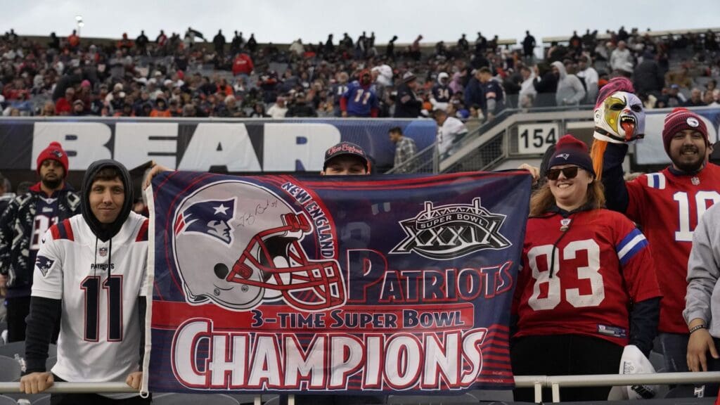 New England Patriots fans celebrates the win against the Chicago Bears at Soldier Field.