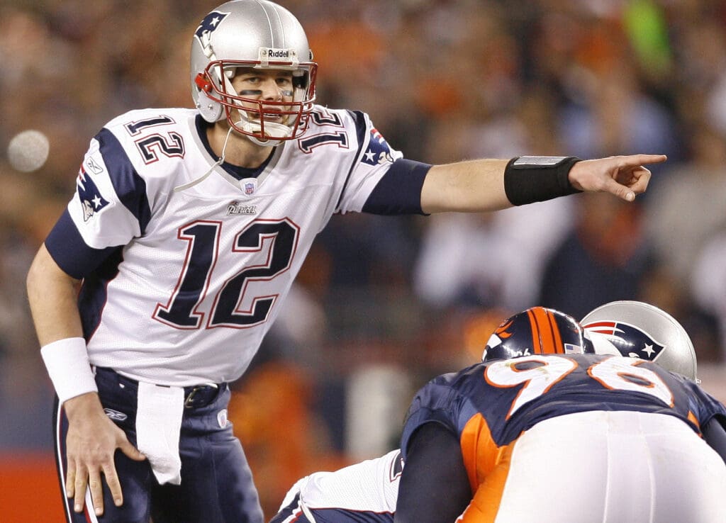 Jan 14, 2006; Denver, CO, USA; New England Patriots quarterback (12) Tom Brady points out the defense against the Denver Broncos during AFC Divisional Playoff game at Invesco Field at Mile High. The Broncos beat the Patriots 27-13.