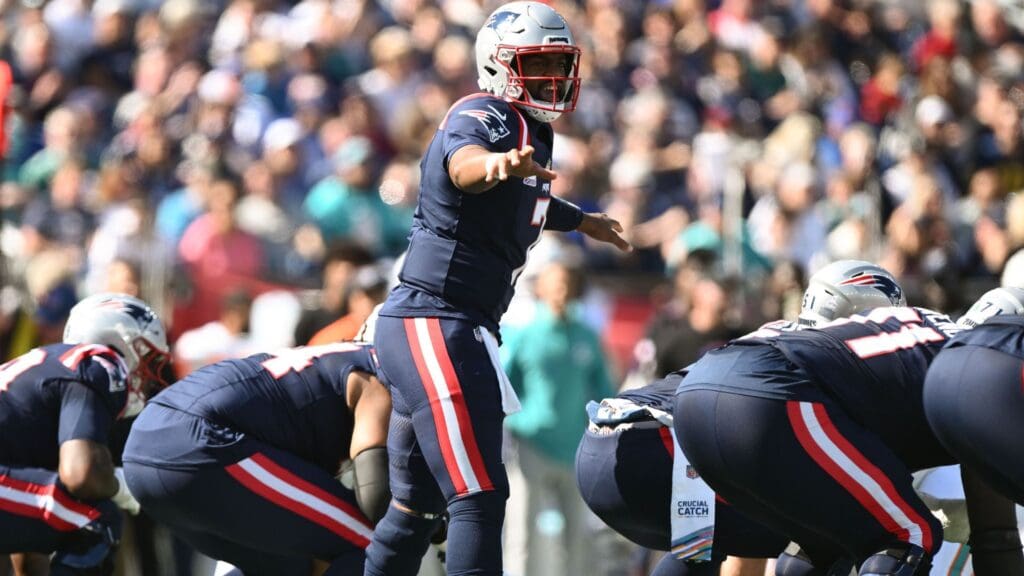 ct 6, 2024; Foxborough, Massachusetts, USA; New England Patriots quarterback Jacoby Brissett (7) calls a play against the Miami Dolphins during the first half at Gillette Stadium.
