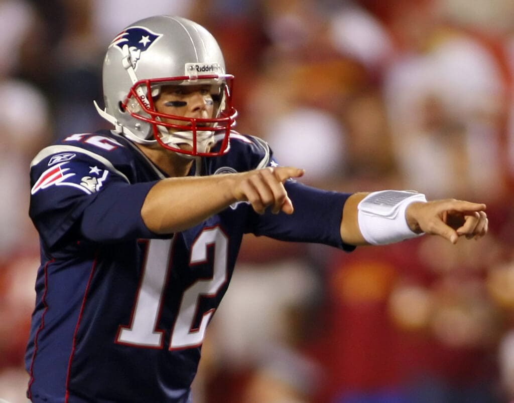 August 28, 2009; Landover, MD, USA; New England Patriots quarterback Tom Brady (12) against the Washington Redskins in the second quarter at FedEx Field. The Patriots won 27-24.