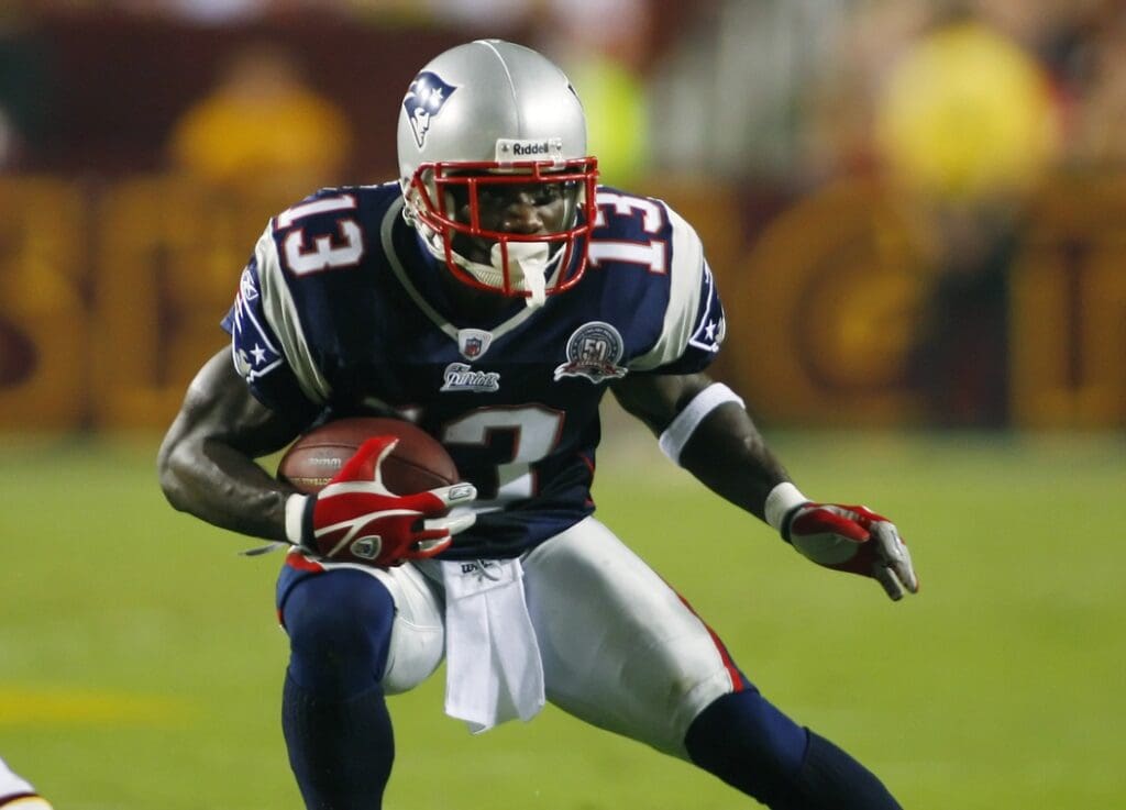 August 28, 2009; Landover, MD, USA; New England Patriots wide receiver Joey Galloway (13) carries downfield against the Washington Redskins in the first quarter at FedEx Field in Landover, Maryland. The Patriots won 27-24.