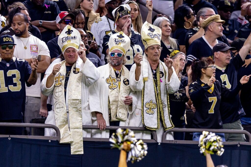 Nov 17, 2024; New Orleans, Louisiana, USA; New Orleans Saints fans celebrate a touchdown by tight end Taysom Hill (7) against the Cleveland Browns during the second half at Caesars Superdome